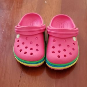 Pink Crocs with rainbow stripe